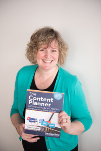 Angela Crocker holding a copy of her book, The Content Planner.