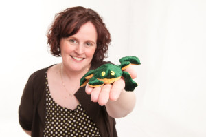 Woman holding a toy frog