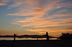 Orange clouds at sunset on the beach atTofino
